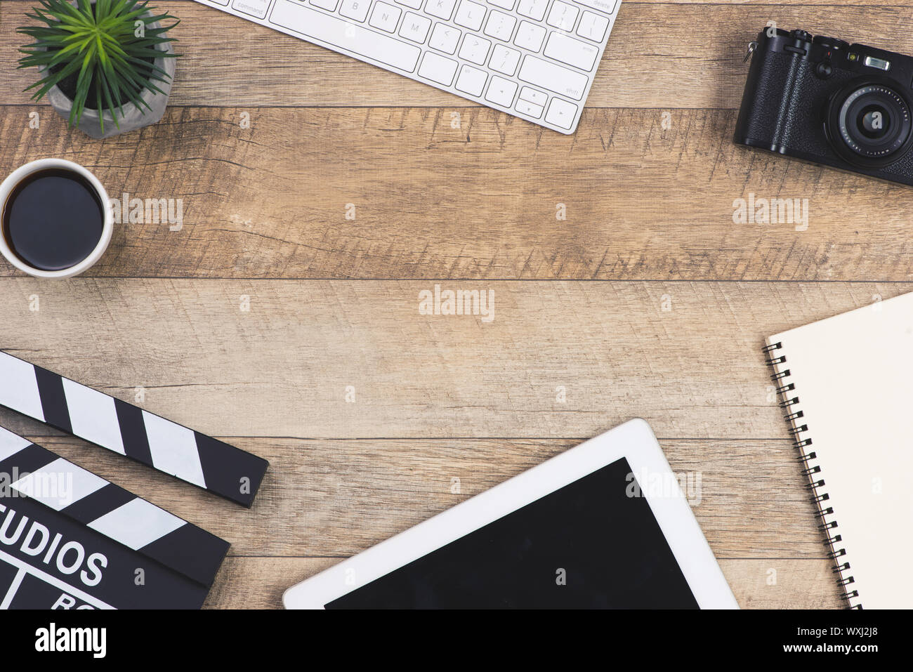 Film director desk with movie clapper board. Top view. Stock Photo