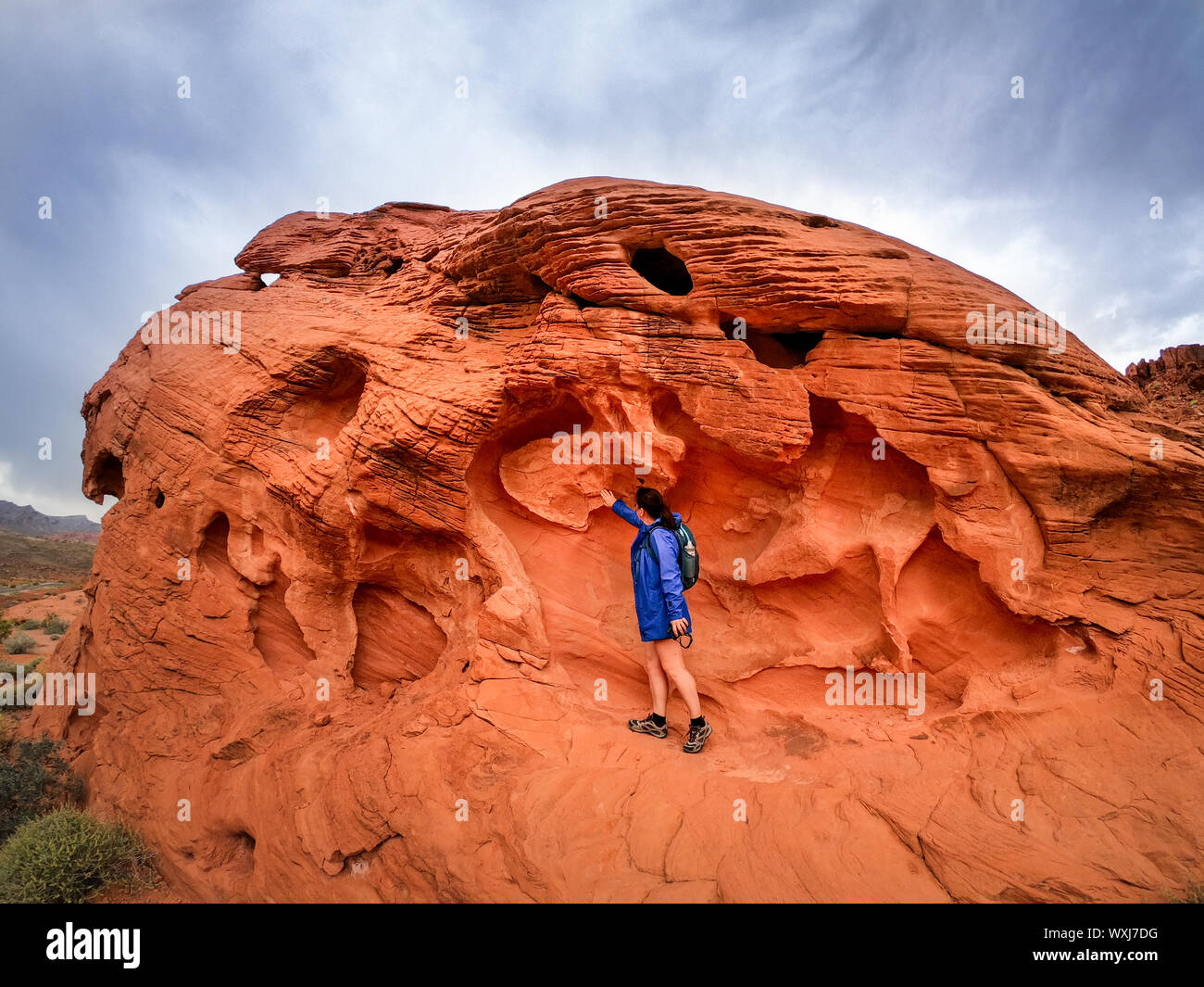 Female hiker looking at rocks, Utah, United States Stock Photo