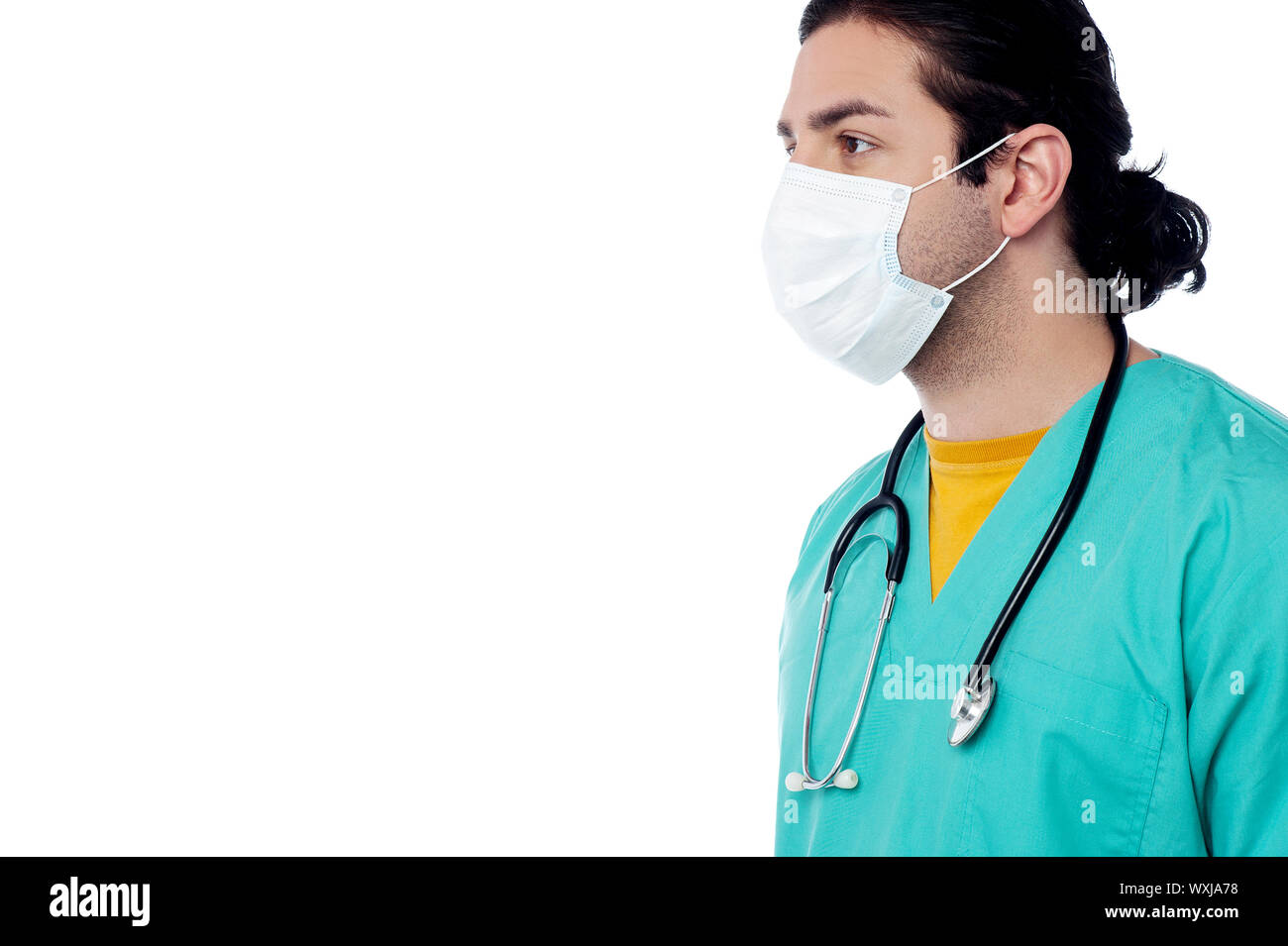 Young male surgeon wearing a face mask Stock Photo - Alamy