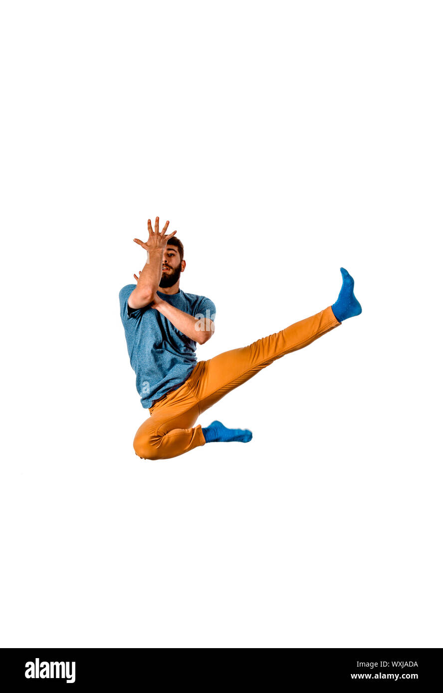 Amazing dancer is doing breakdance on a white background Stock Photo