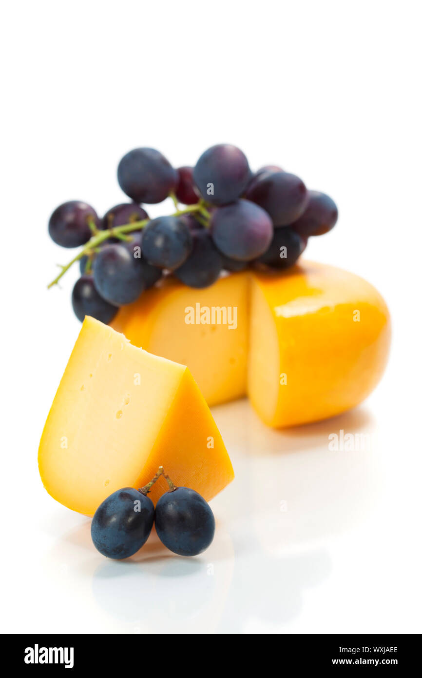 grapes and cheese over white Stock Photo Alamy