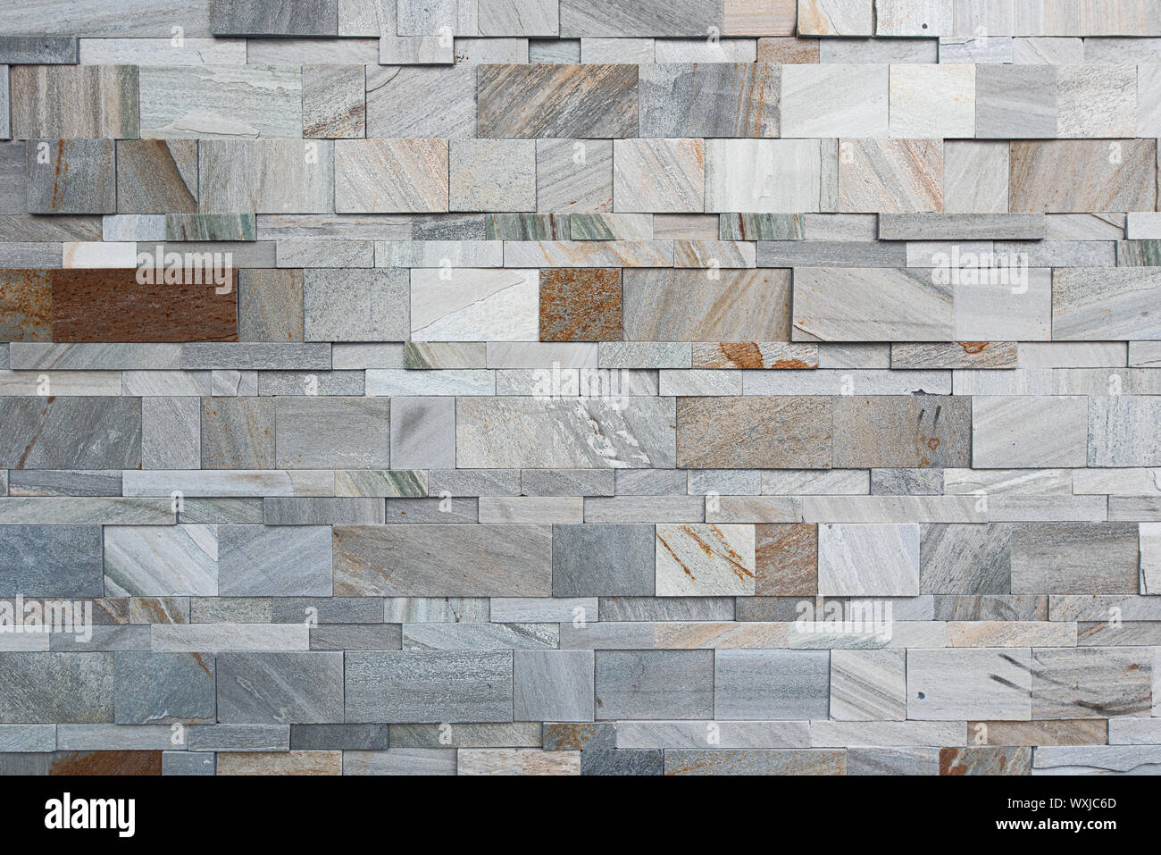 Split modern artificial grey and brown marble wall texture Stock Photo