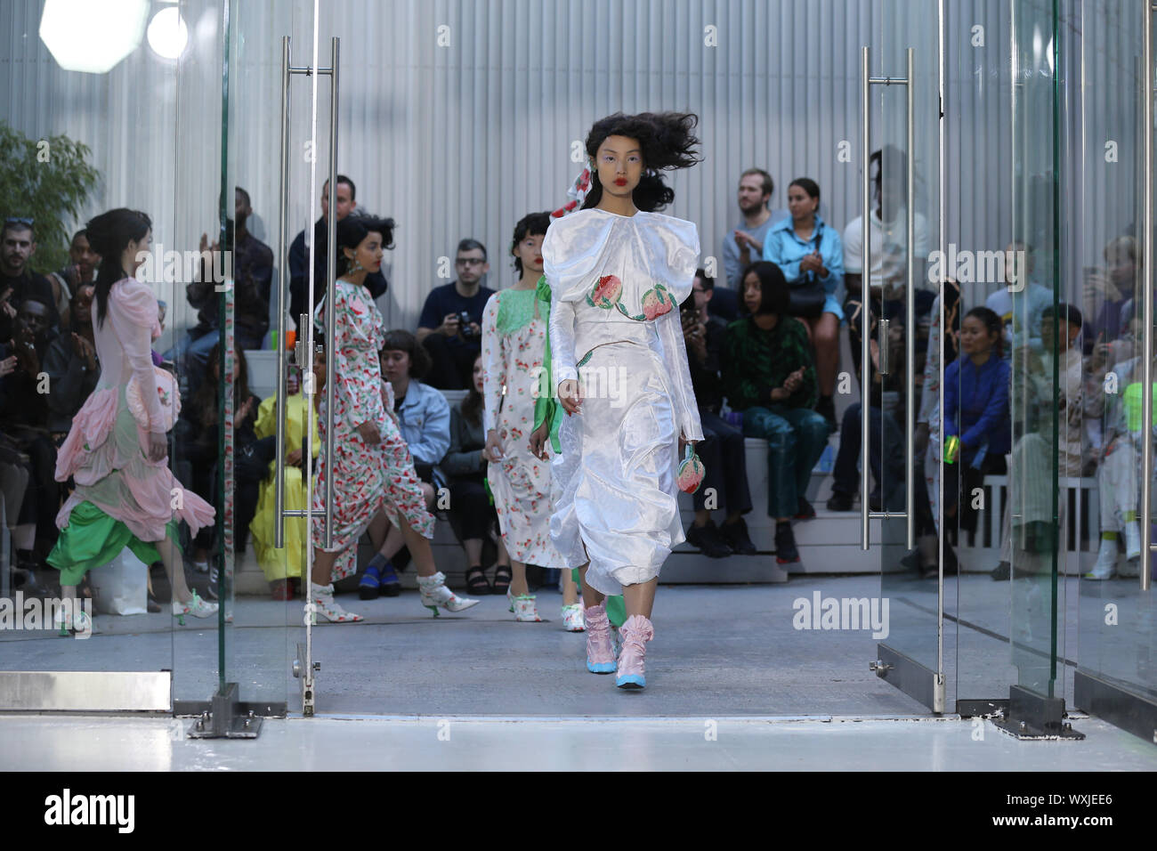 Models on the catwalk of Fashion East 