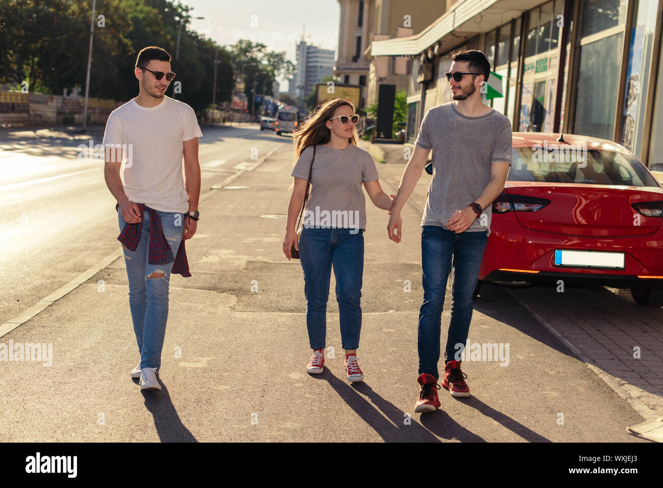 Group of friends having fun outdoors in sunny day in downtown Stock ...