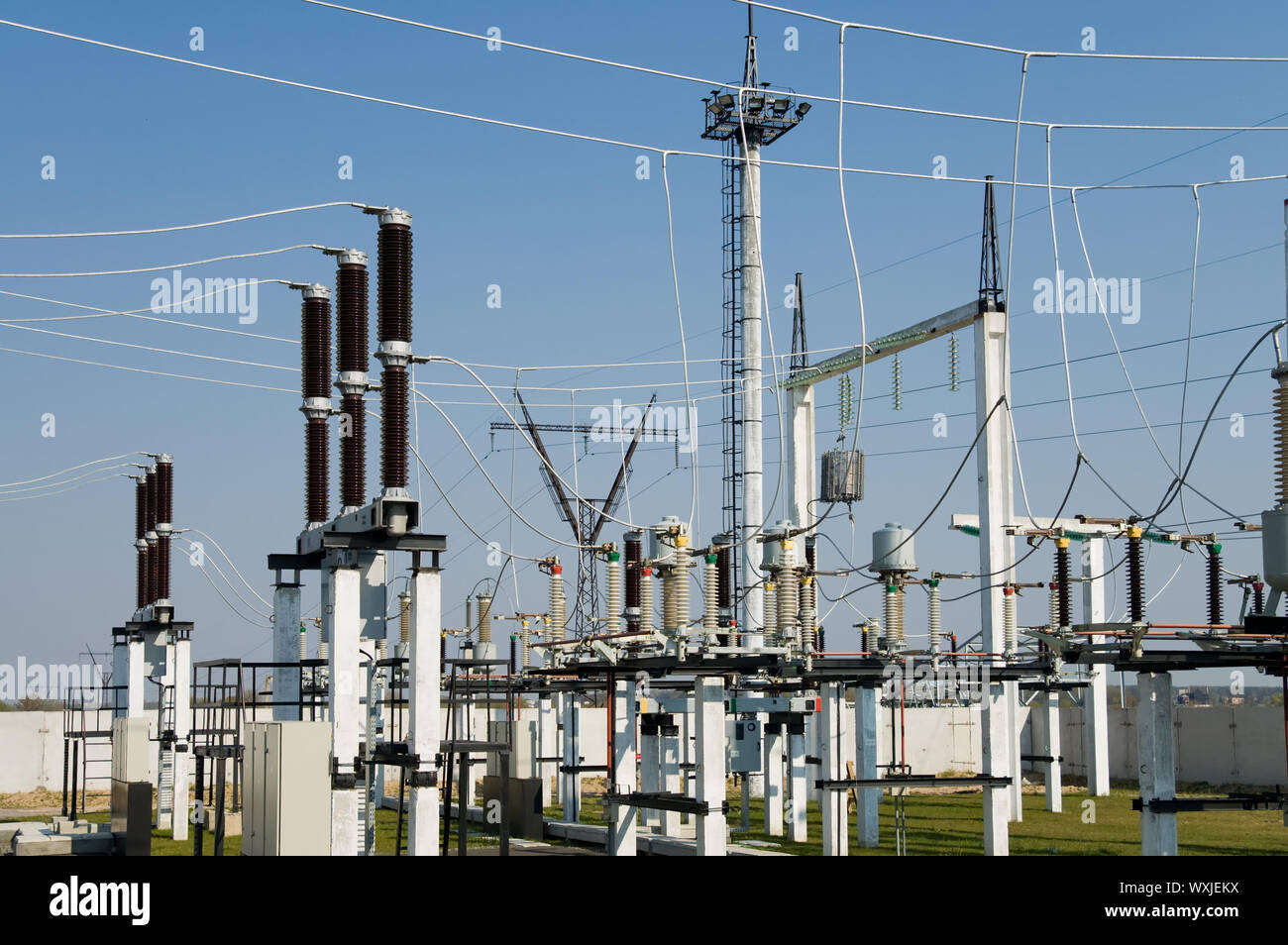 view to high-voltage substation with switch and disconnector Stock Photo