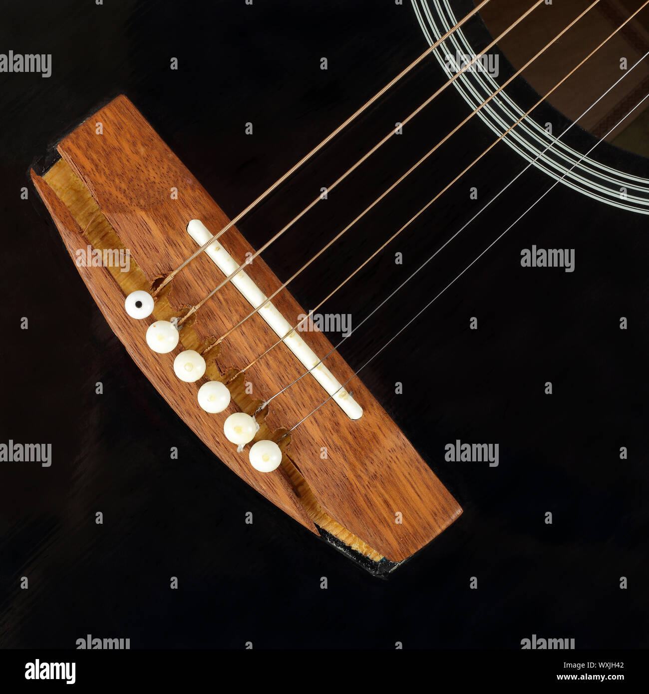 Guitar repair and service Top view fragment broken bridge black