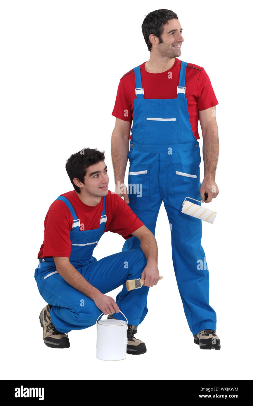 craftsman painter and apprentice working together Stock Photo