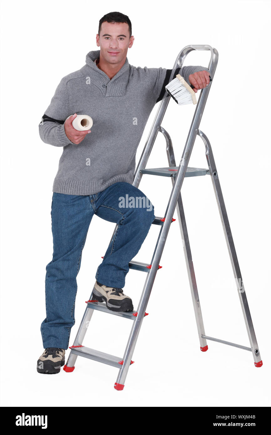 Painter resting on a stepladder Stock Photo