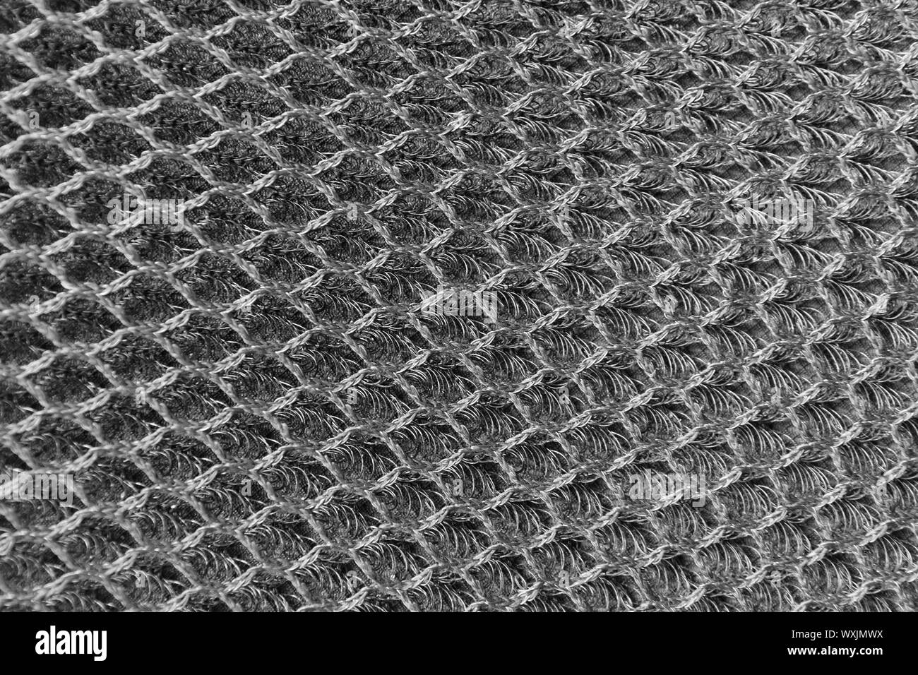 Macro metal chain link fibers. Textured background. Stock Photo