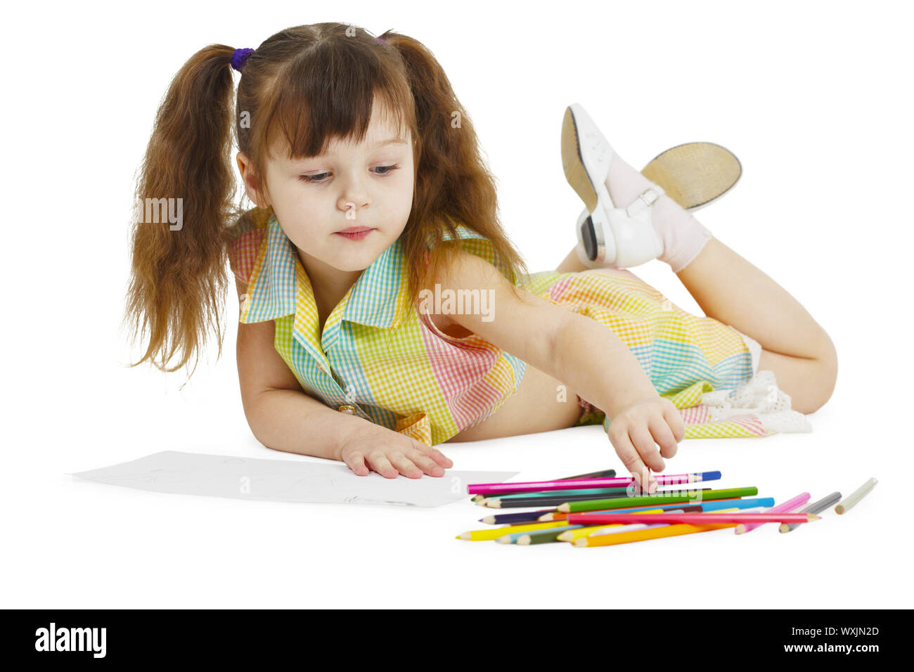 A little girl draws with crayons on a white background Stock Photo - Alamy