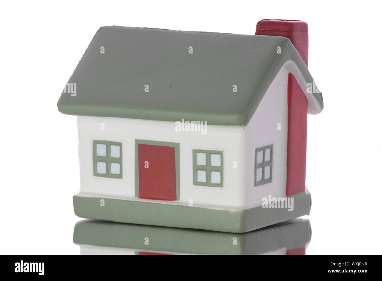 Small house model isolated on white background Stock Photo - Alamy