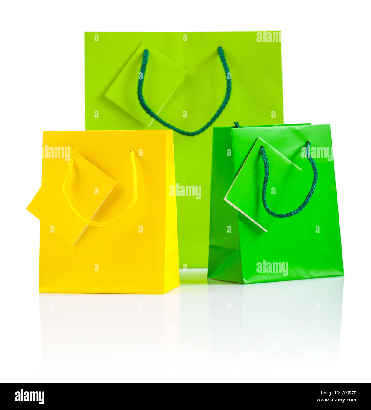 three colored paper bags isolated on white Stock Photo