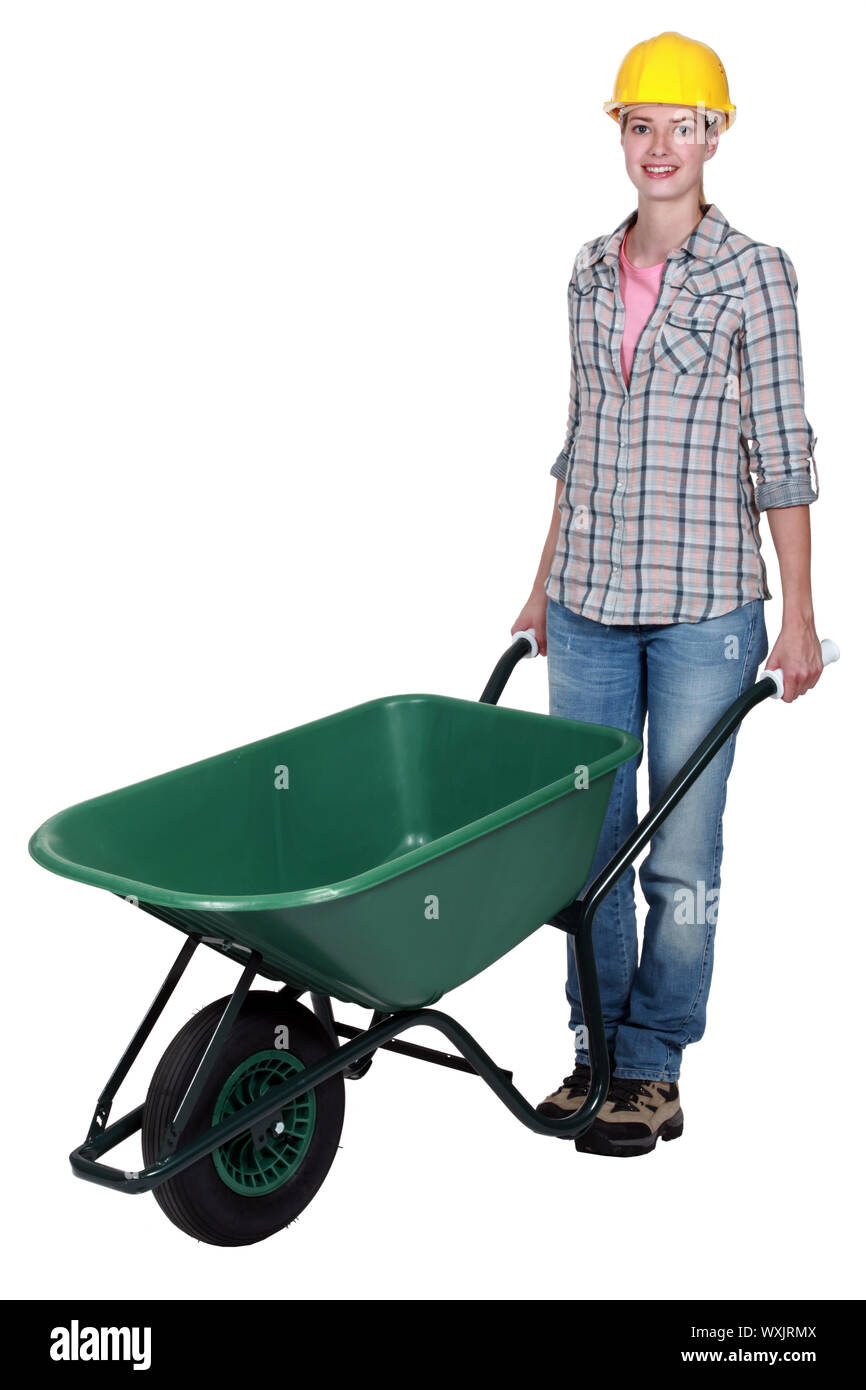 craftswoman pushing a wheelbarrow Stock Photo - Alamy