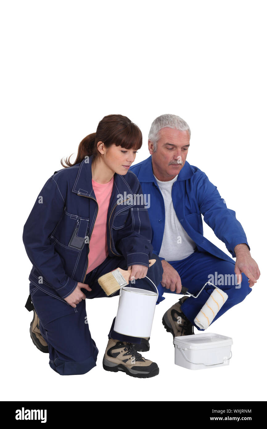 Decorator with young female apprentice Stock Photo