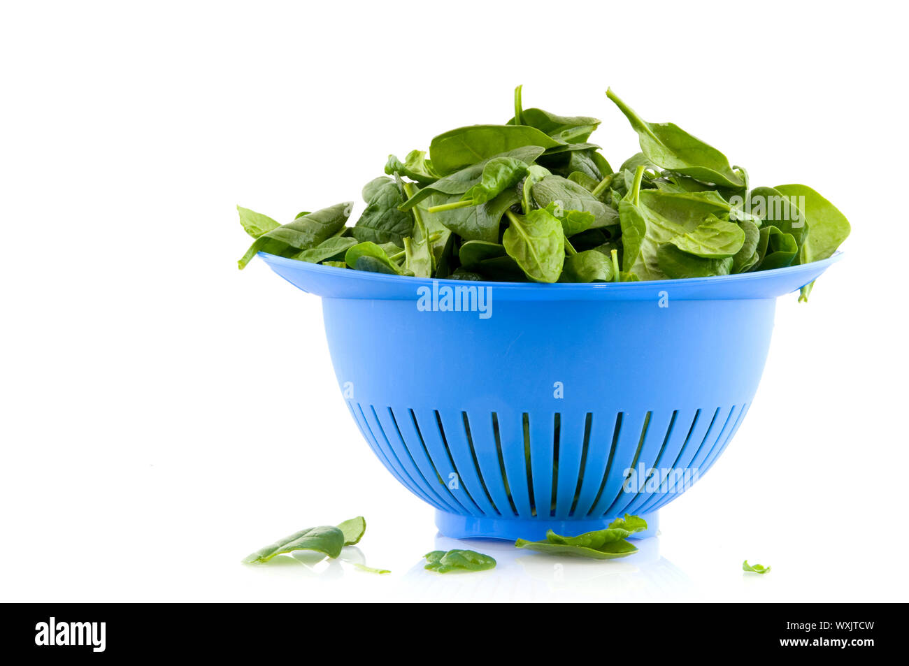 Fresh spinach in strainer Stock Photo Alamy