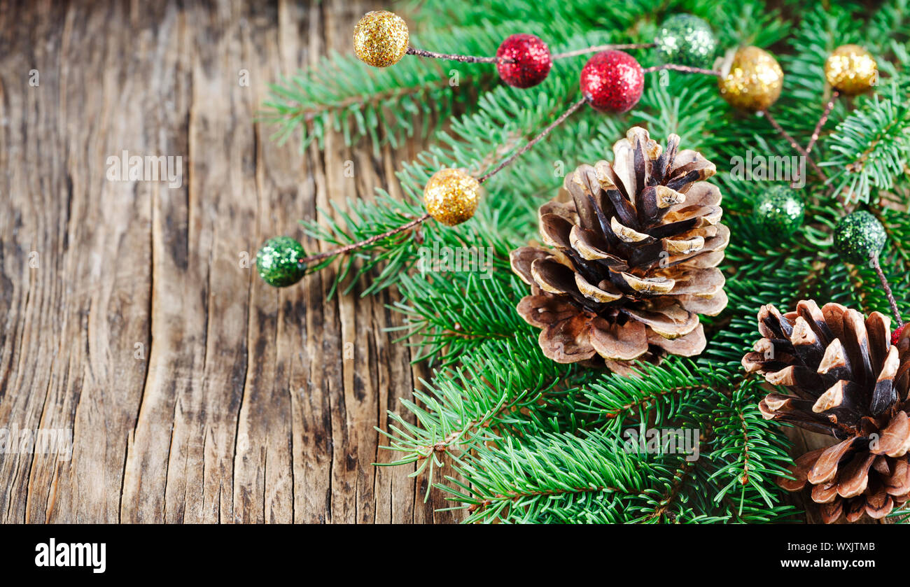 Christmas decoration with fir branches and pine cones Stock Photo