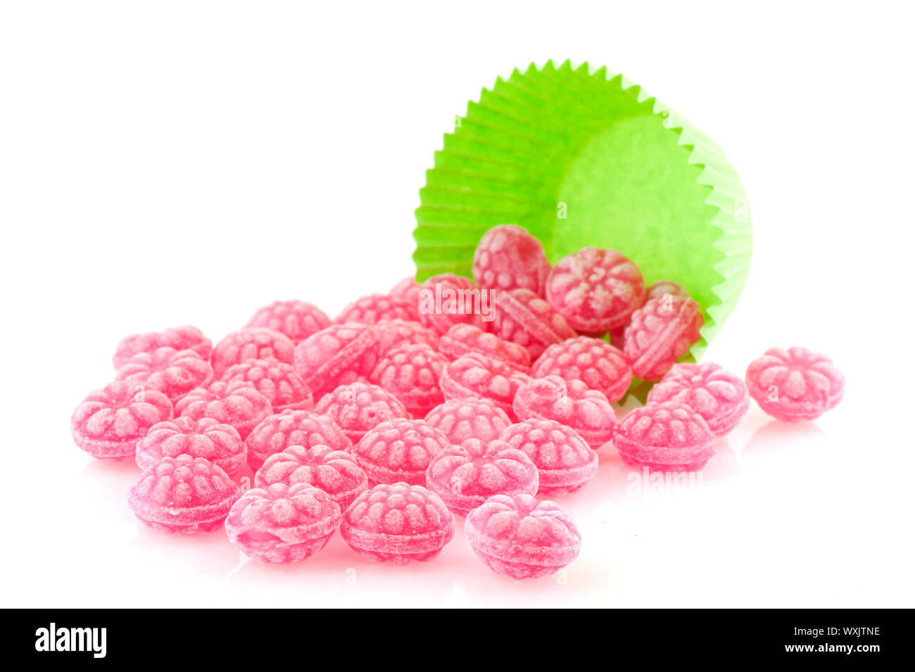 Candy Sweets Raspberry Raspberry tasty candy sweets in green cup cake paper Stock Photo - Alamy