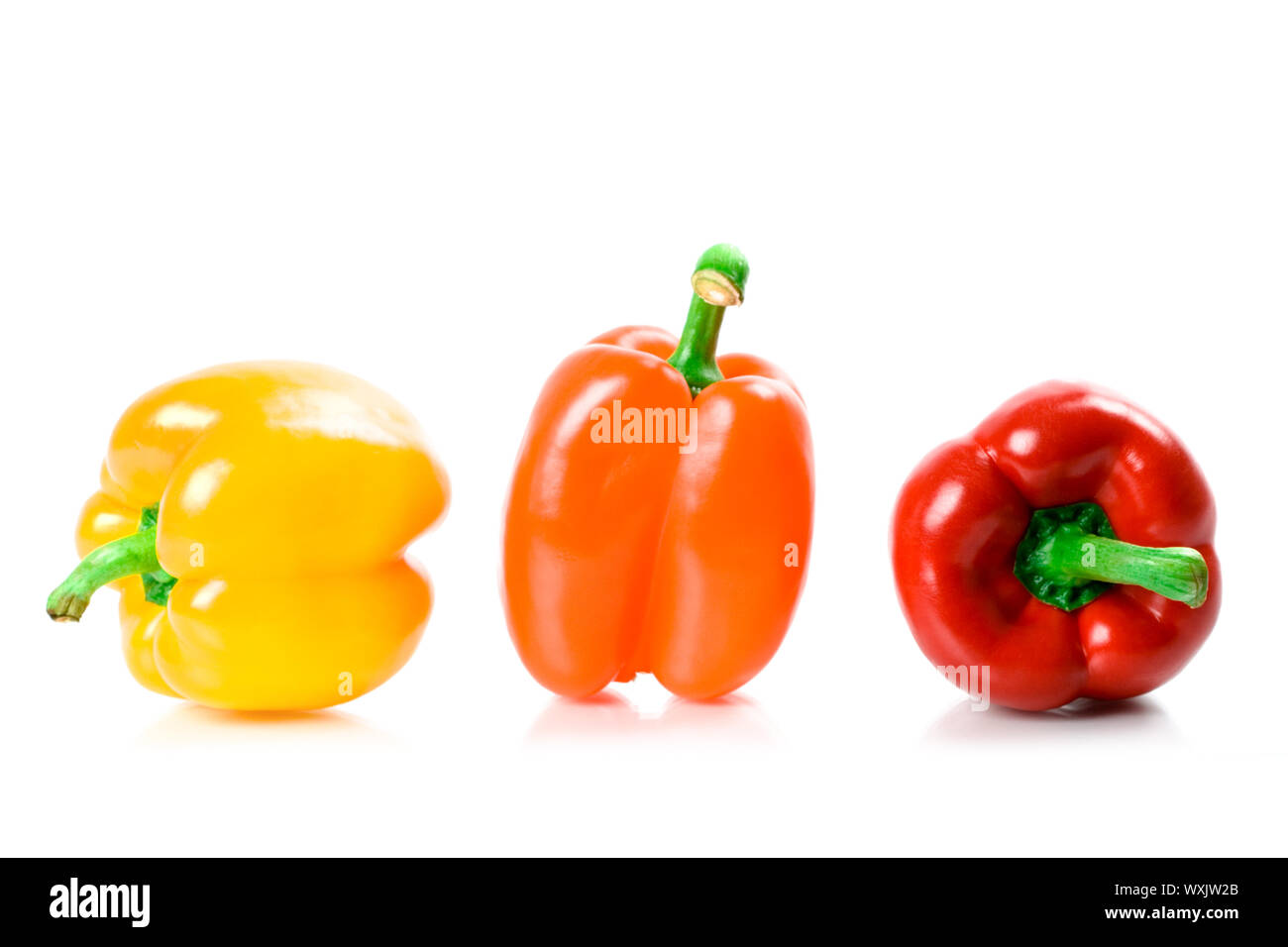 three bell peppers isolated on white background Stock Photo - Alamy