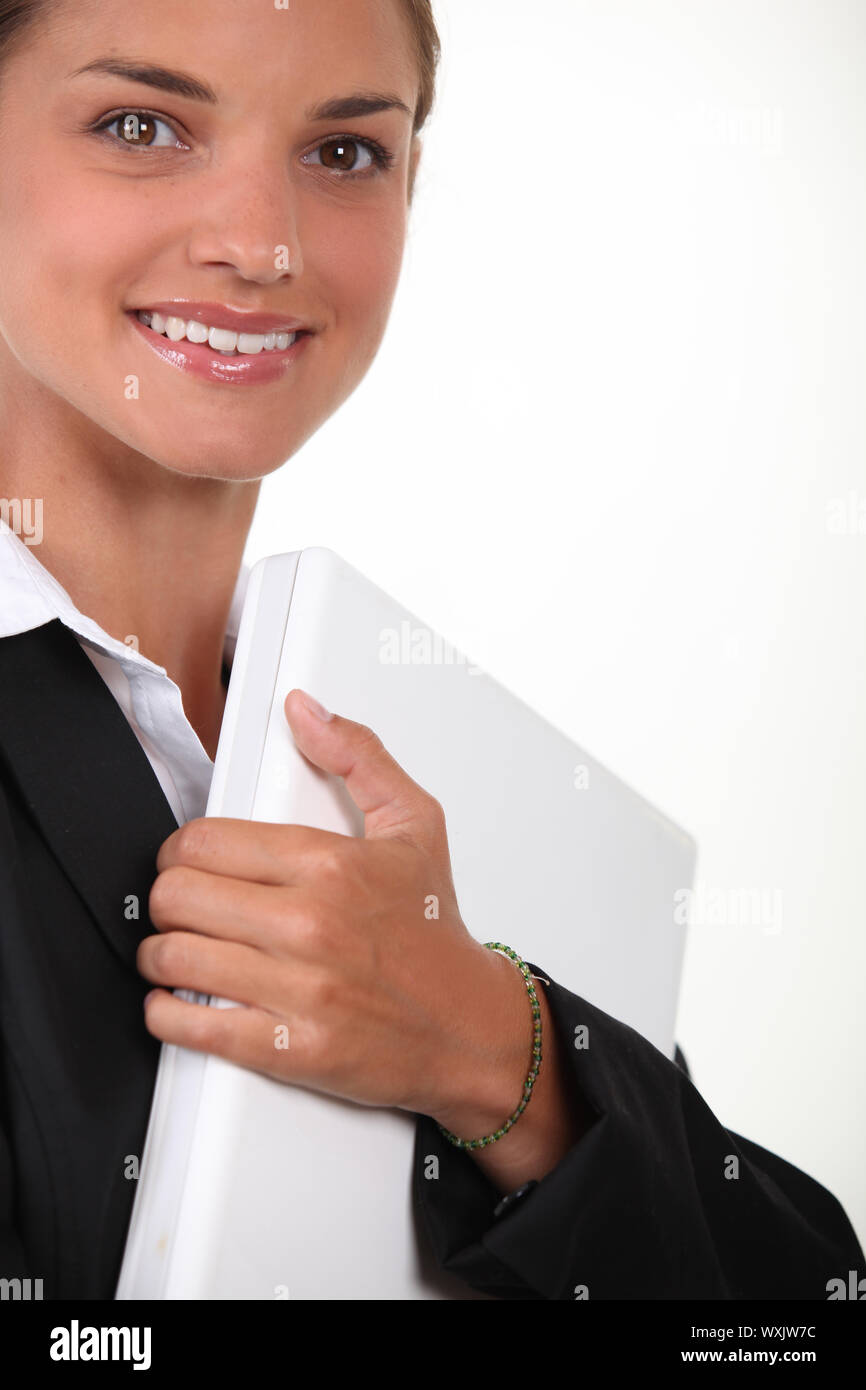 Woman clutching laptop hires stock photography and images Alamy