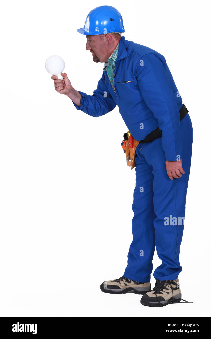 Electrocuted man staring at a light bulb Stock Photo Alamy