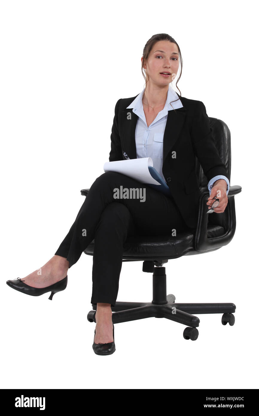 Woman writing a business report Stock Photo
