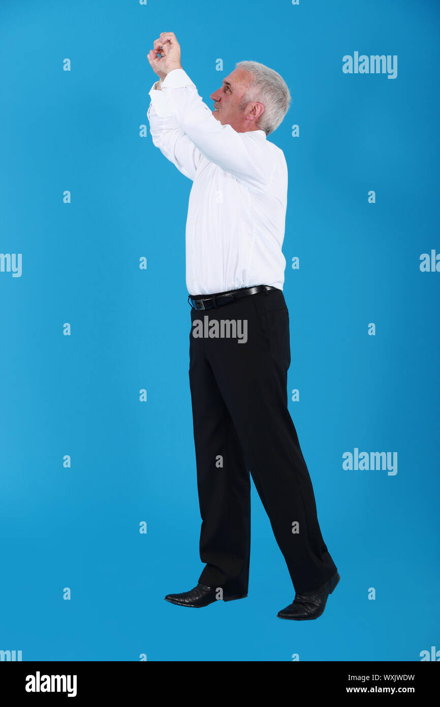 Man gripping an invisible bar Stock Photo Alamy