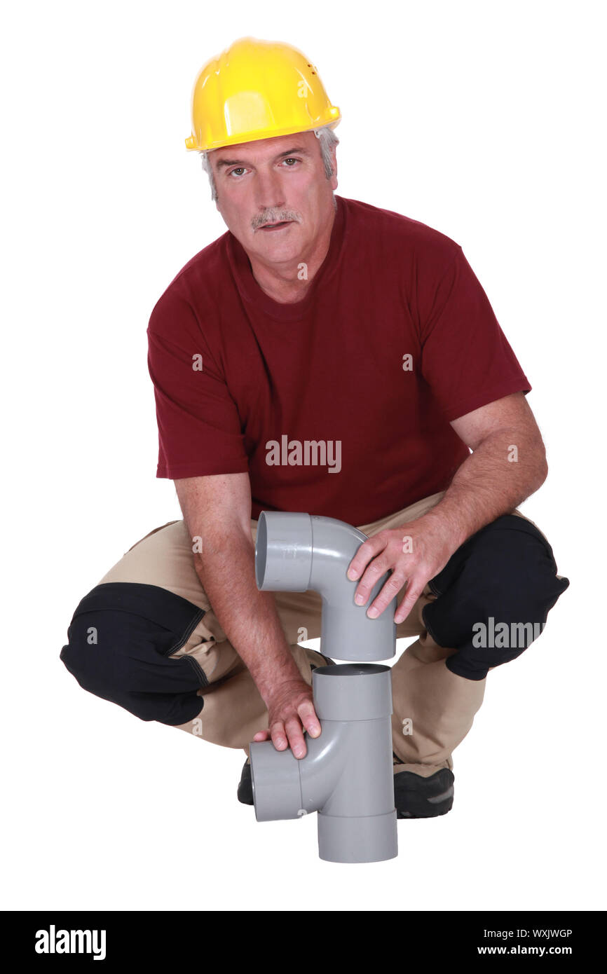 plumber fixing a plastic pipe Stock Photo Alamy