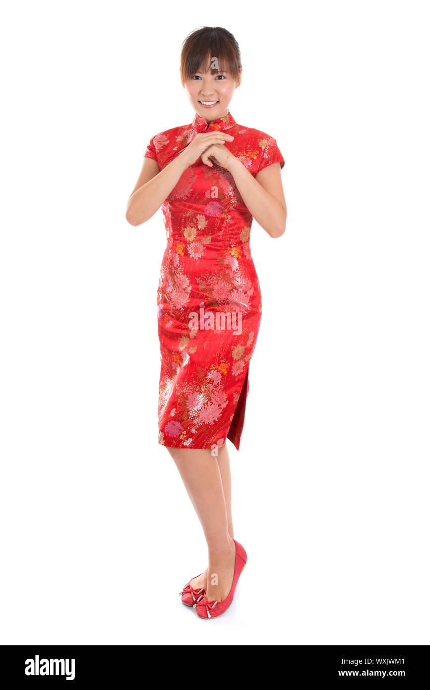 Full length Asian woman with Chinese traditional dress cheongsam or qipao  respecting on Chinese New Year Festival. Female model isolated on white  back Stock Photo - Alamy