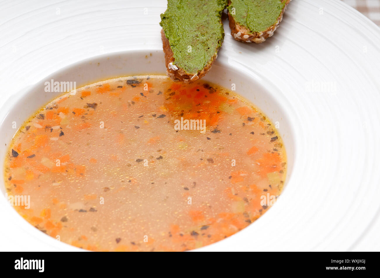 classic Italian minestrone " passato"soup with pesto crostini on side