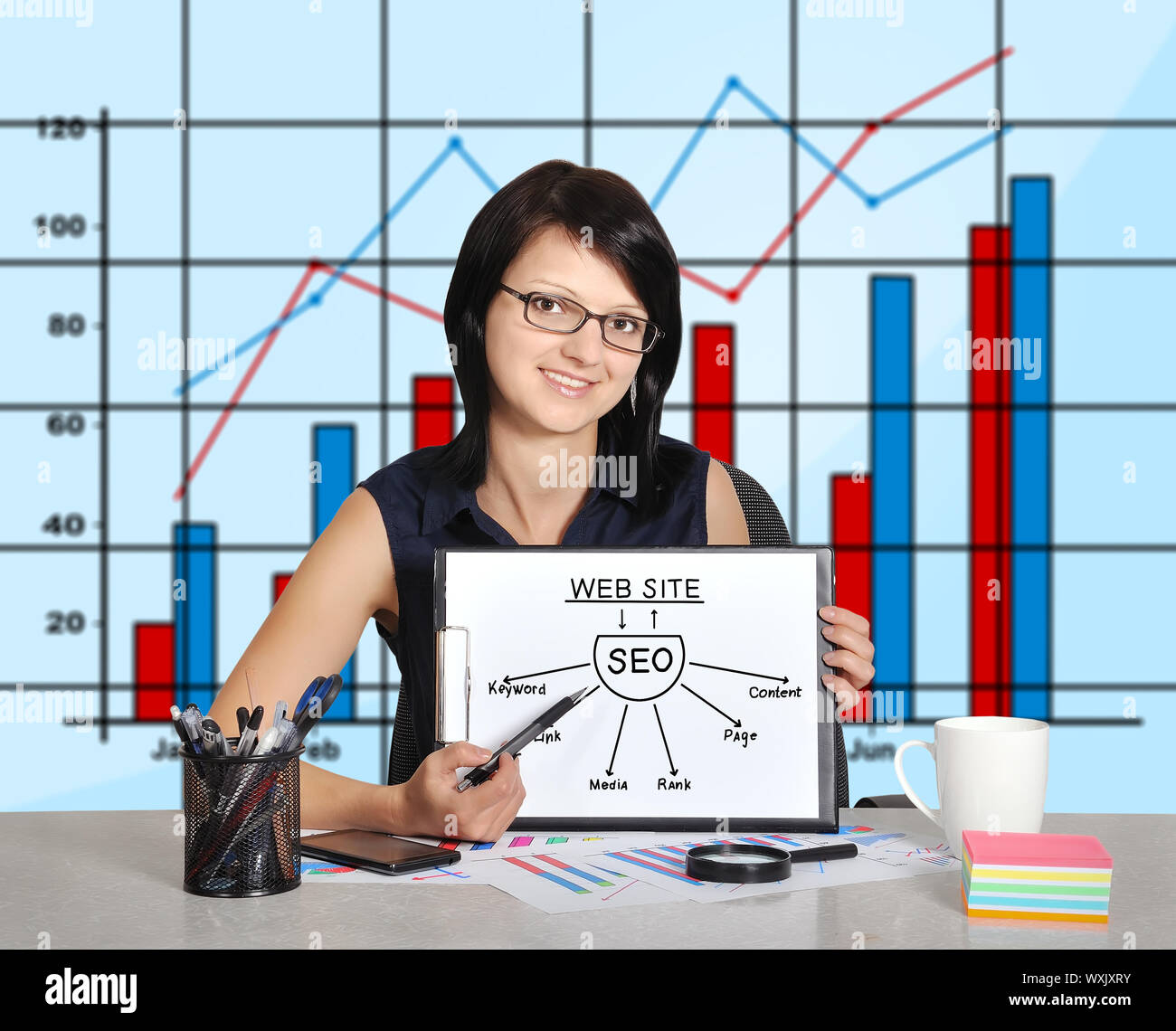 businesswoman and clipboard with seo scheme  sitting in office Stock Photo