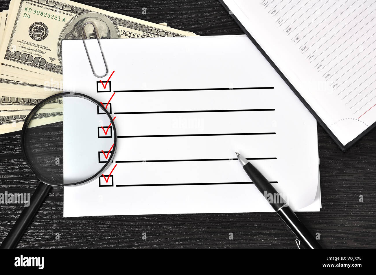 poster with check box and money in the office Stock Photo - Alamy