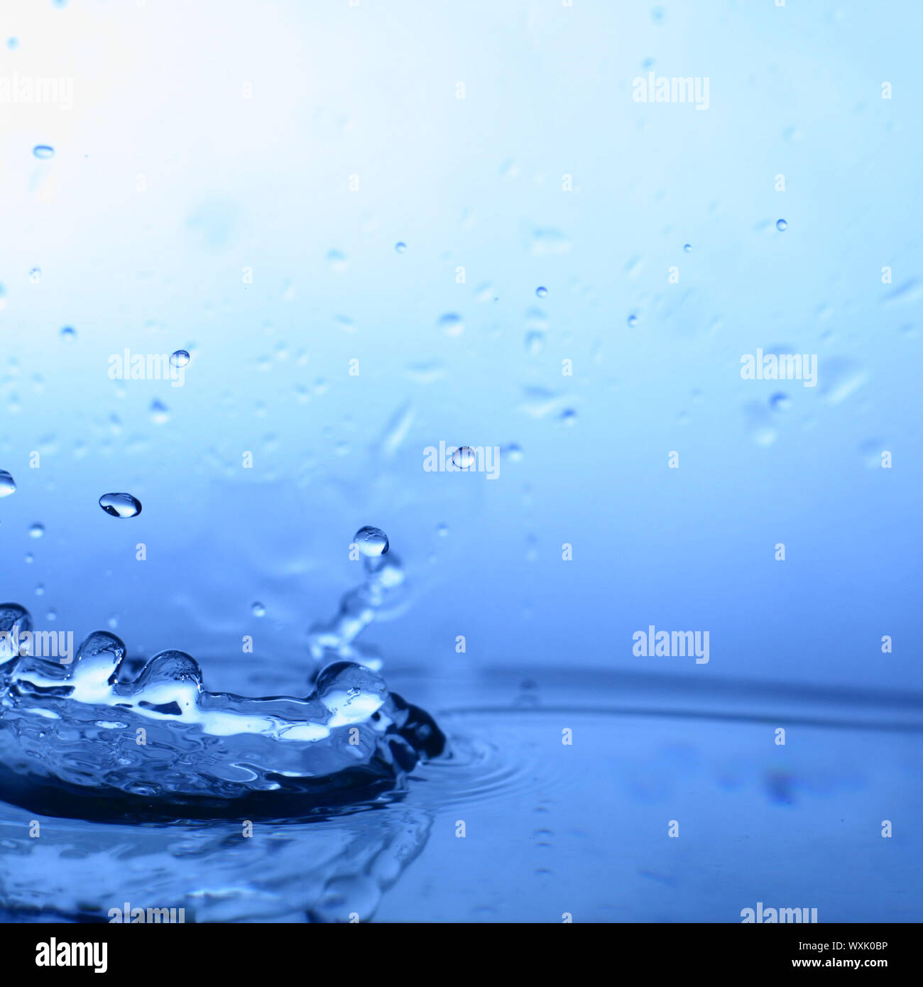 great blue water splash close up macro Stock Photo - Alamy
