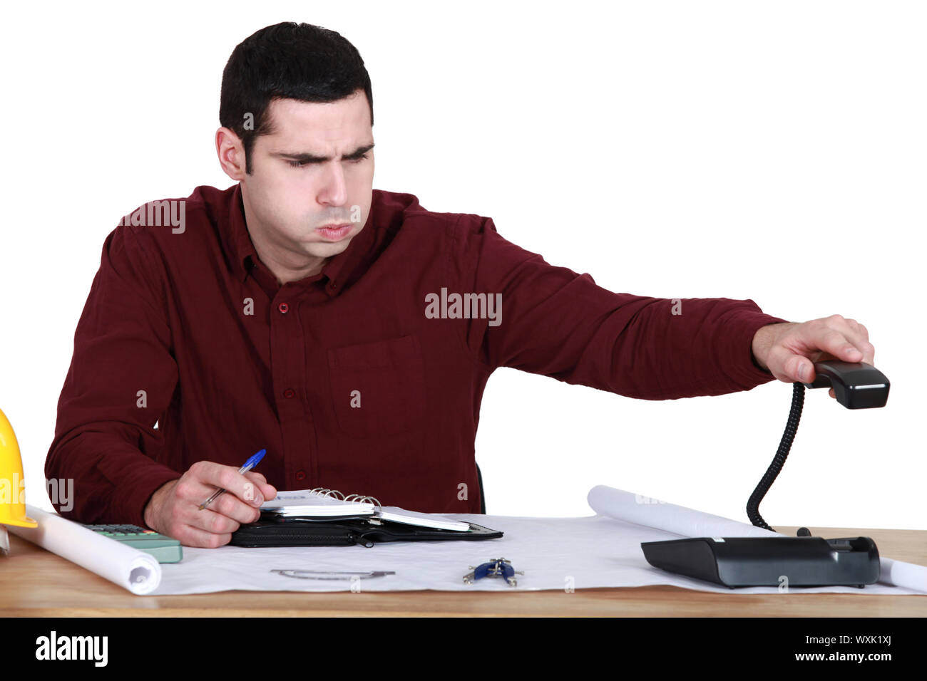 Stressed man hanging up the phone Stock Photo: 274555194 - Alamy