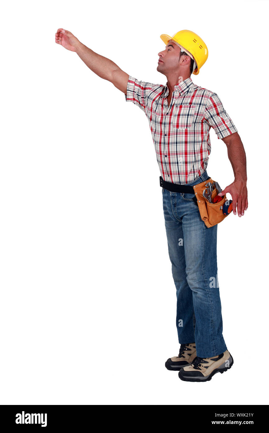 A construction worker trying to reach for something Stock Photo Alamy