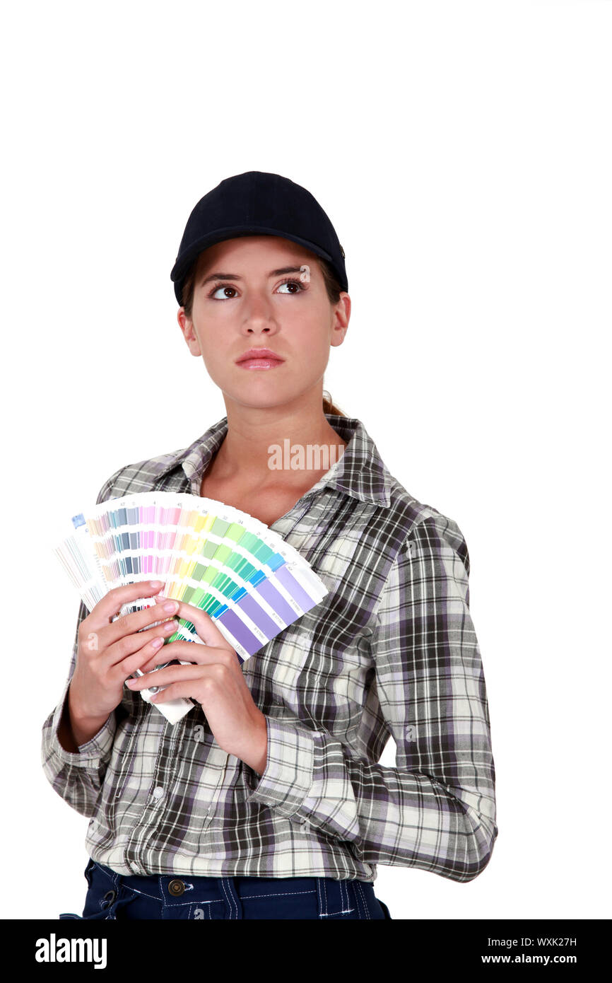 female painter holding color charts Stock Photo - Alamy