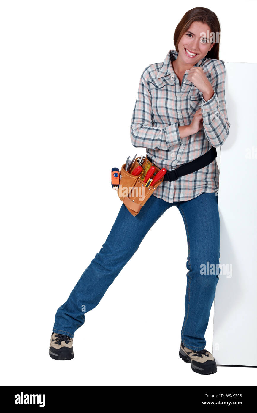 Pushing Over Building A female construction worker pushing against a wall Stock Photo - Alamy