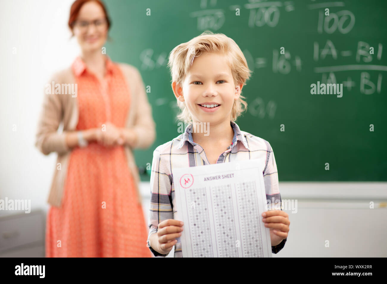 Pupil feeling happy after getting excellent mark Stock Photo