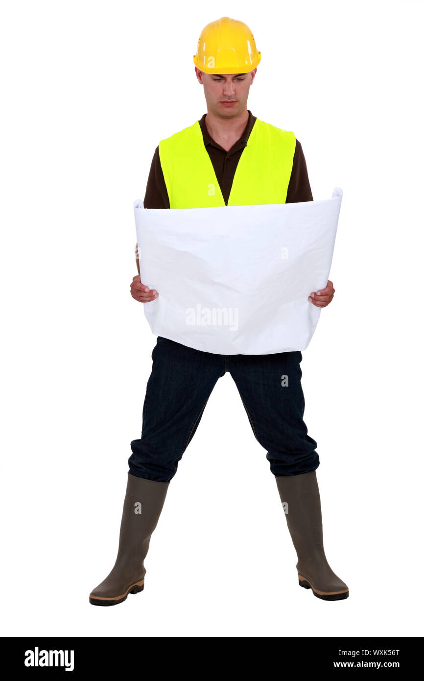 A foreman checking the plans. Stock Photo