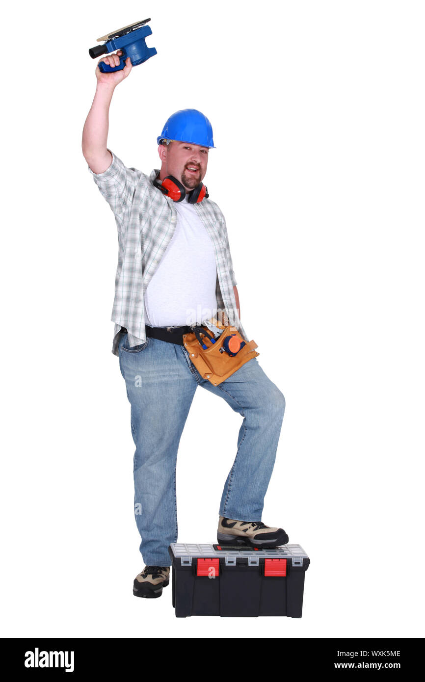 Man using power sander Stock Photo Alamy