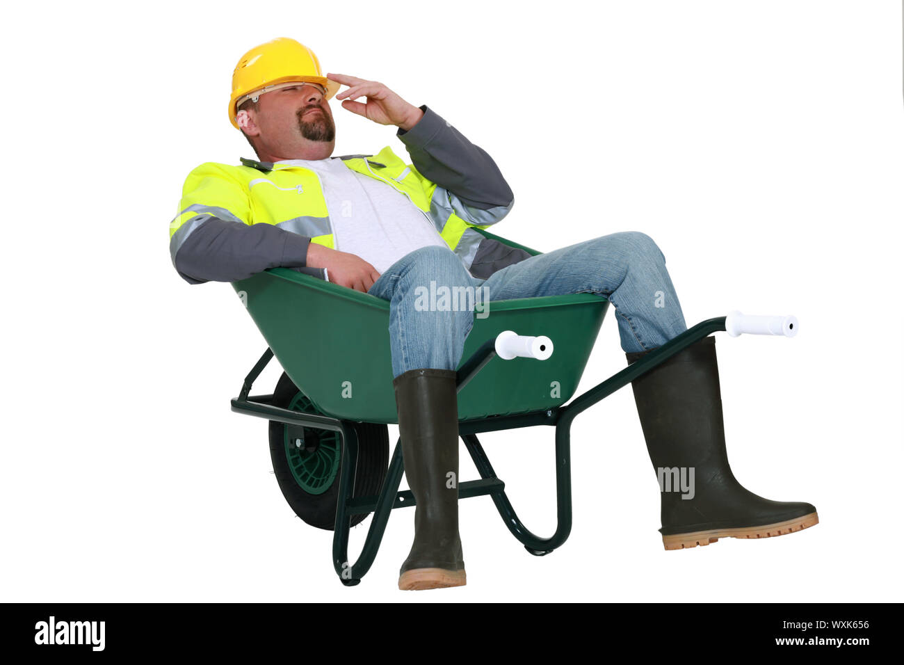 craftsman lying in a wheelbarrow Stock Photo - Alamy
