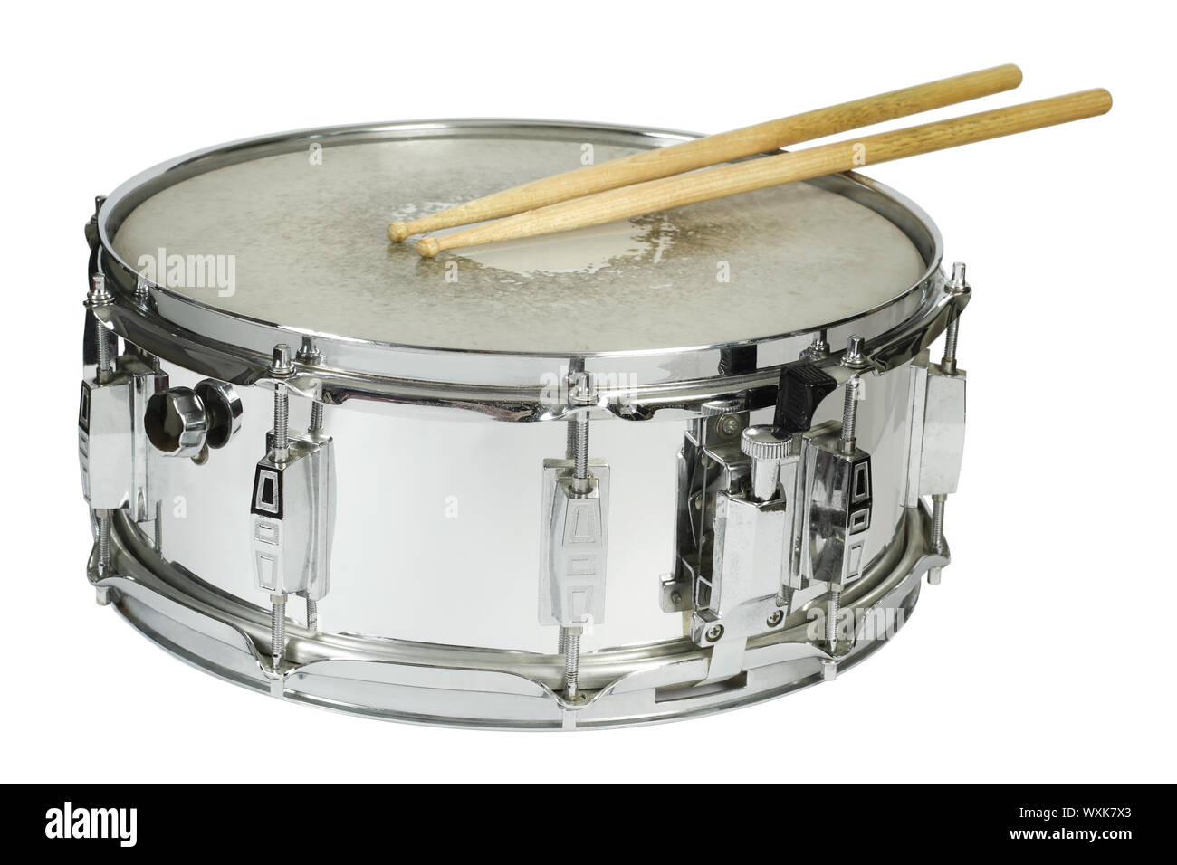 Drumsticks resting on a well-worn metal snare drum Stock Photo - Alamy