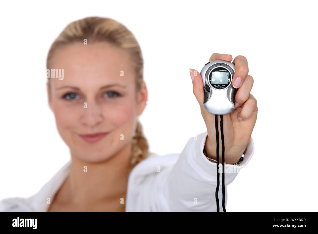 Woman holding stop watch Stock Photo