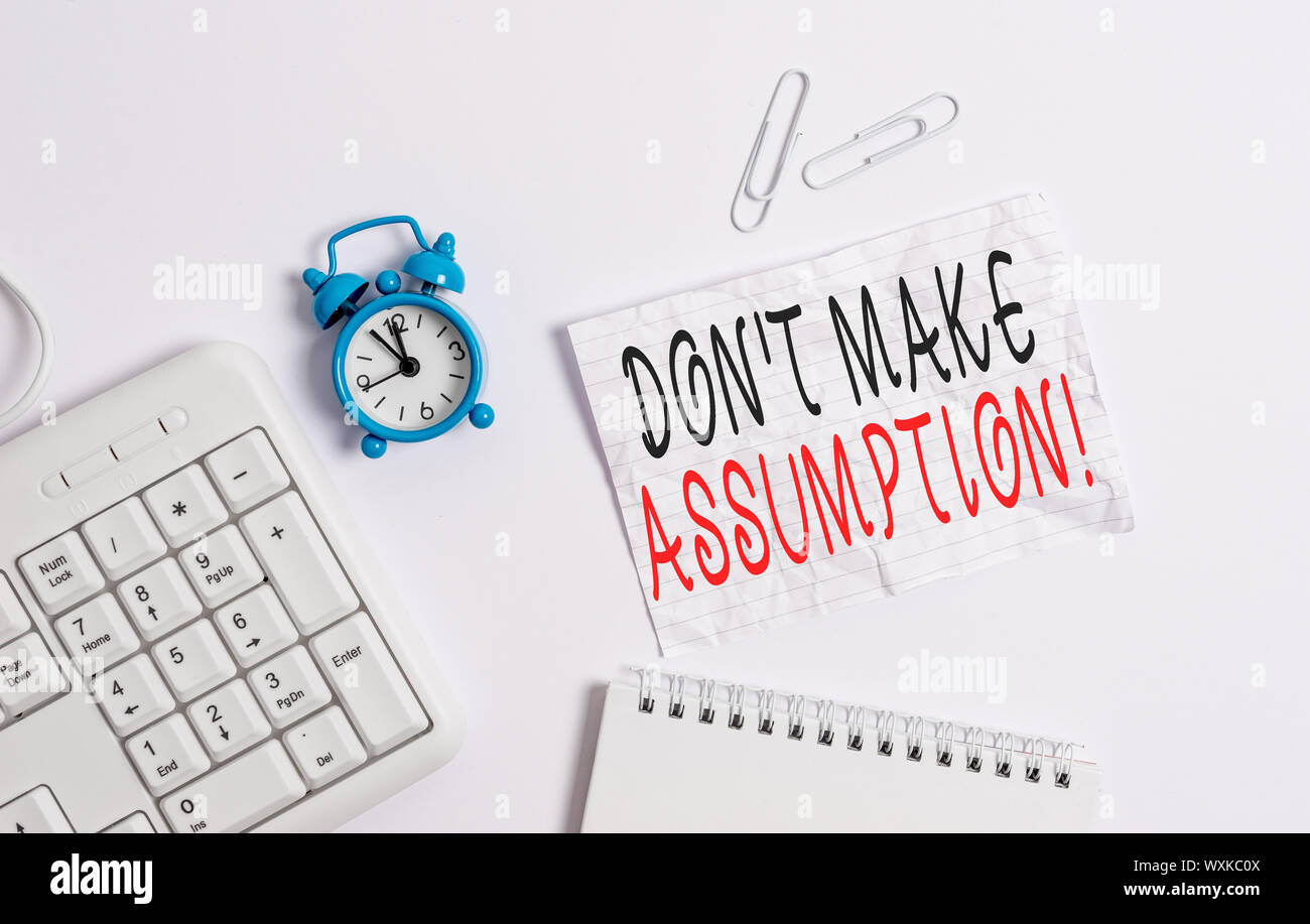Writing note showing Don T Make Assumption. Business concept for something that you assume to be case even without proof Blank paper with copy space o Stock Photo