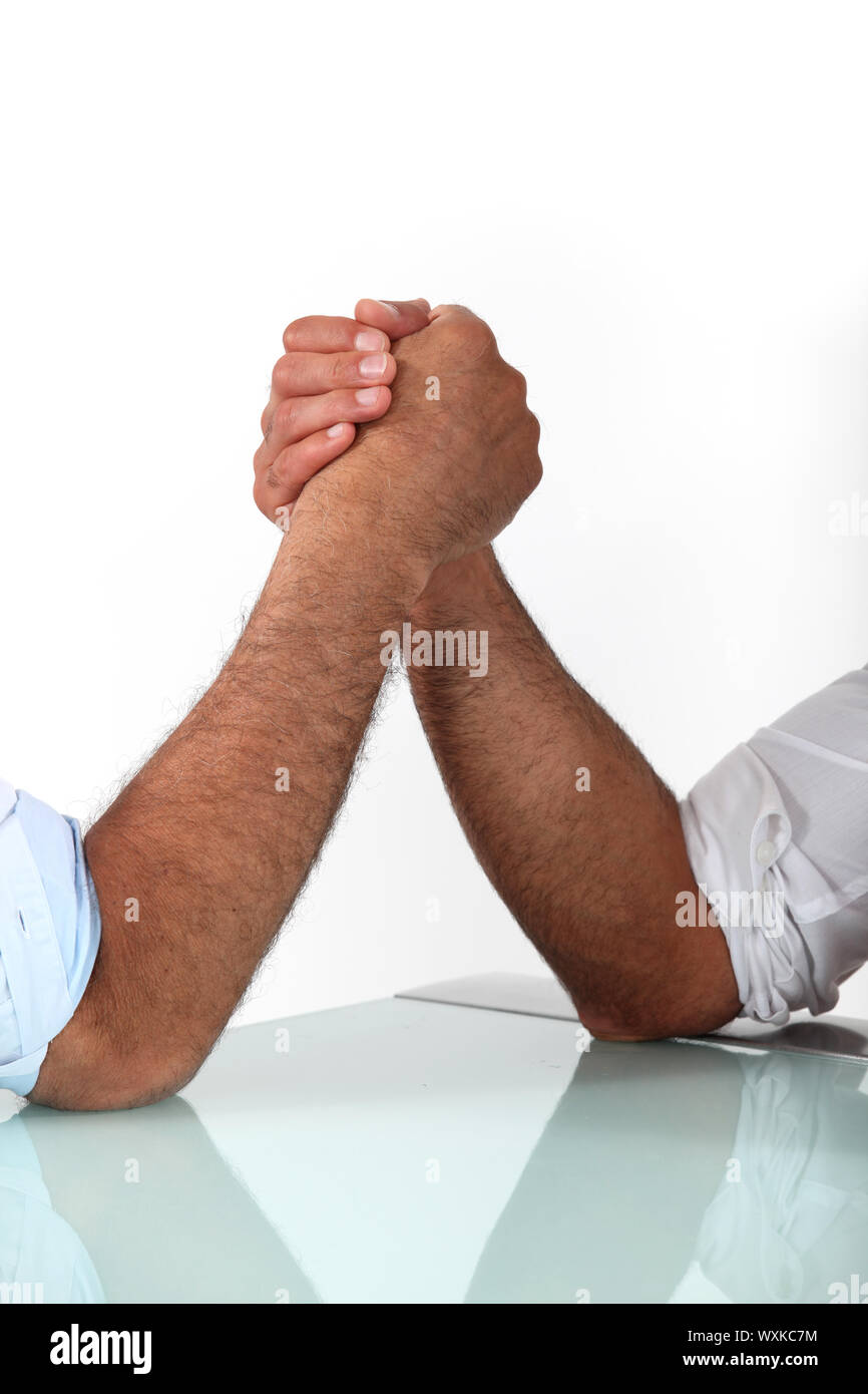 arm wrestling between males Stock Photo