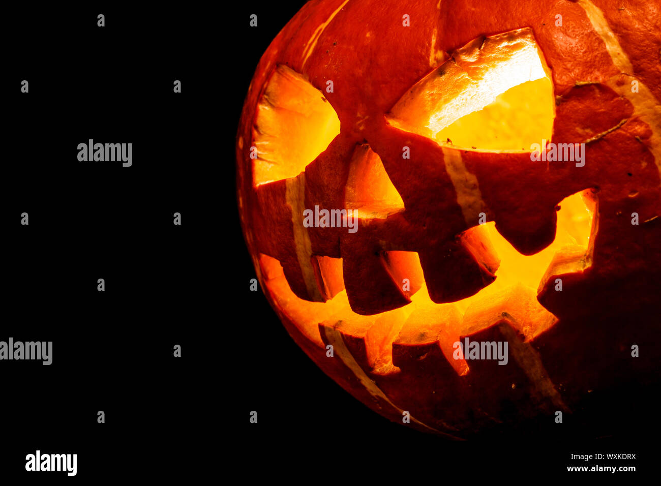 Halloween - old jack-o-lantern on black background Stock Photo