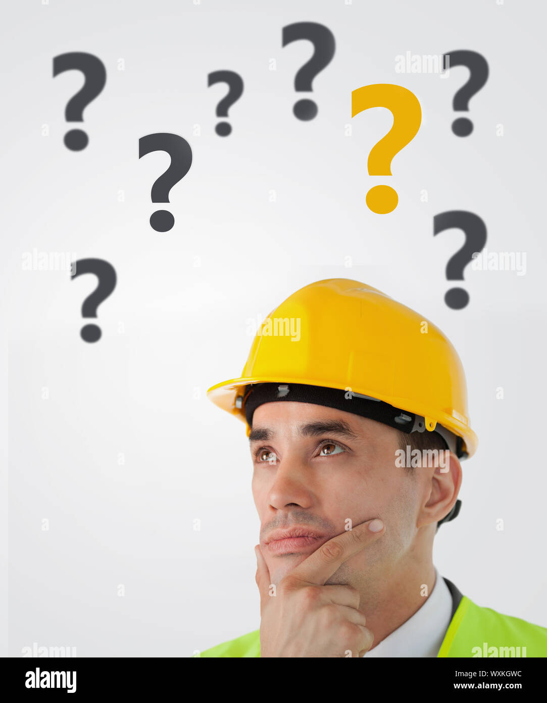 Man in hard hat thinking on white background with question marks Stock Photo Alamy