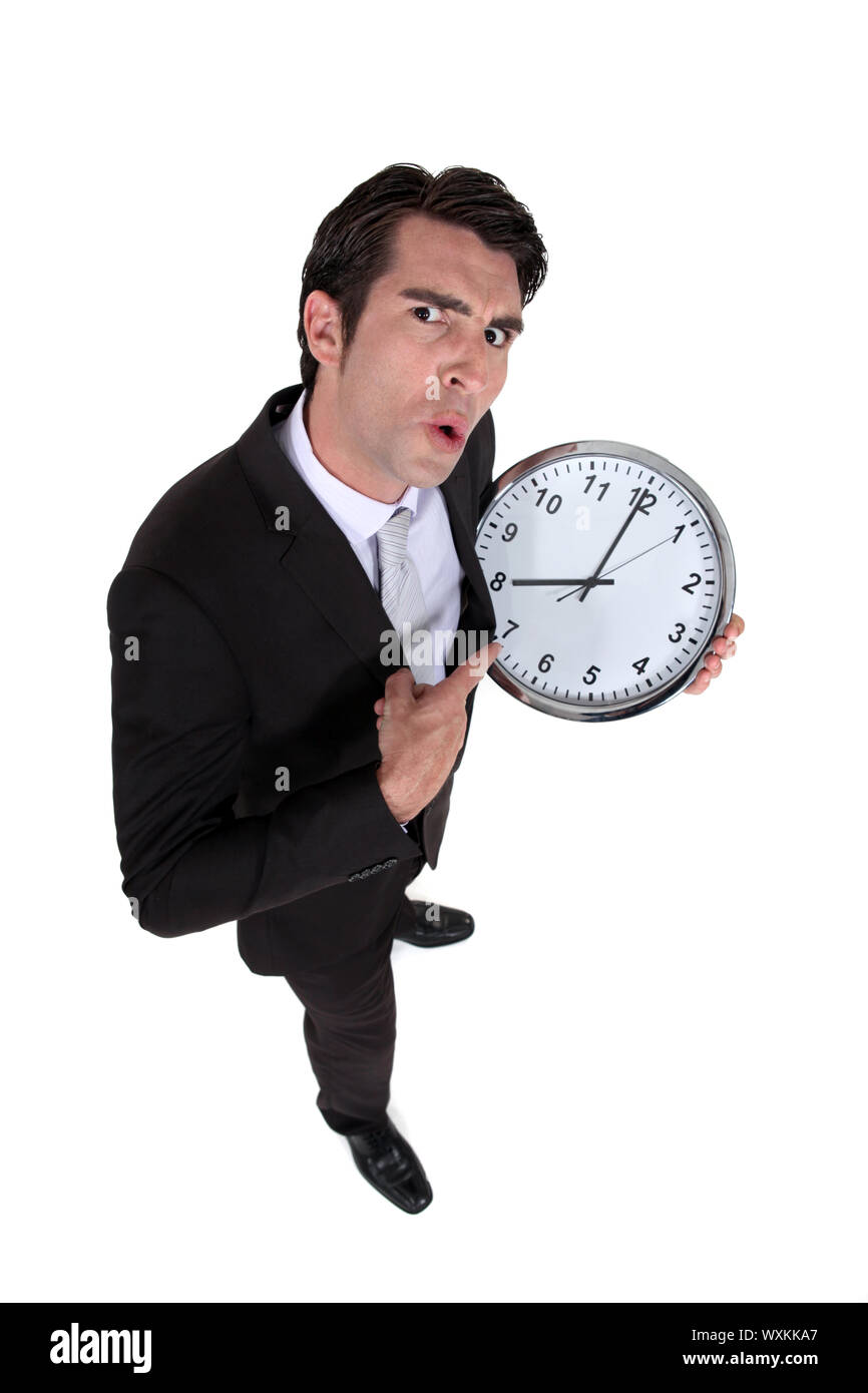 Man with a big clock Stock Photo - Alamy