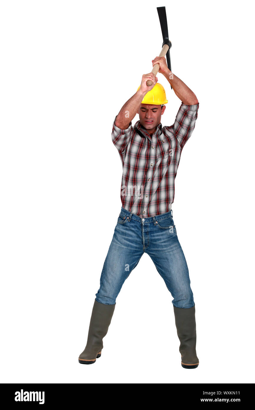 Construction worker with pickaxe Stock Photo