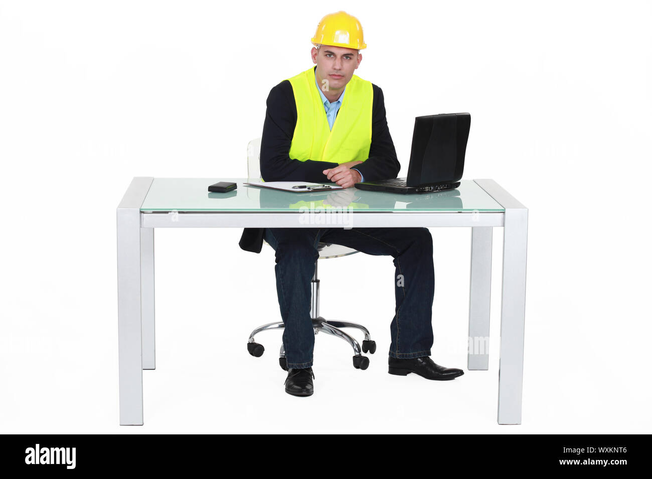 Architect sat by desk Stock Photo