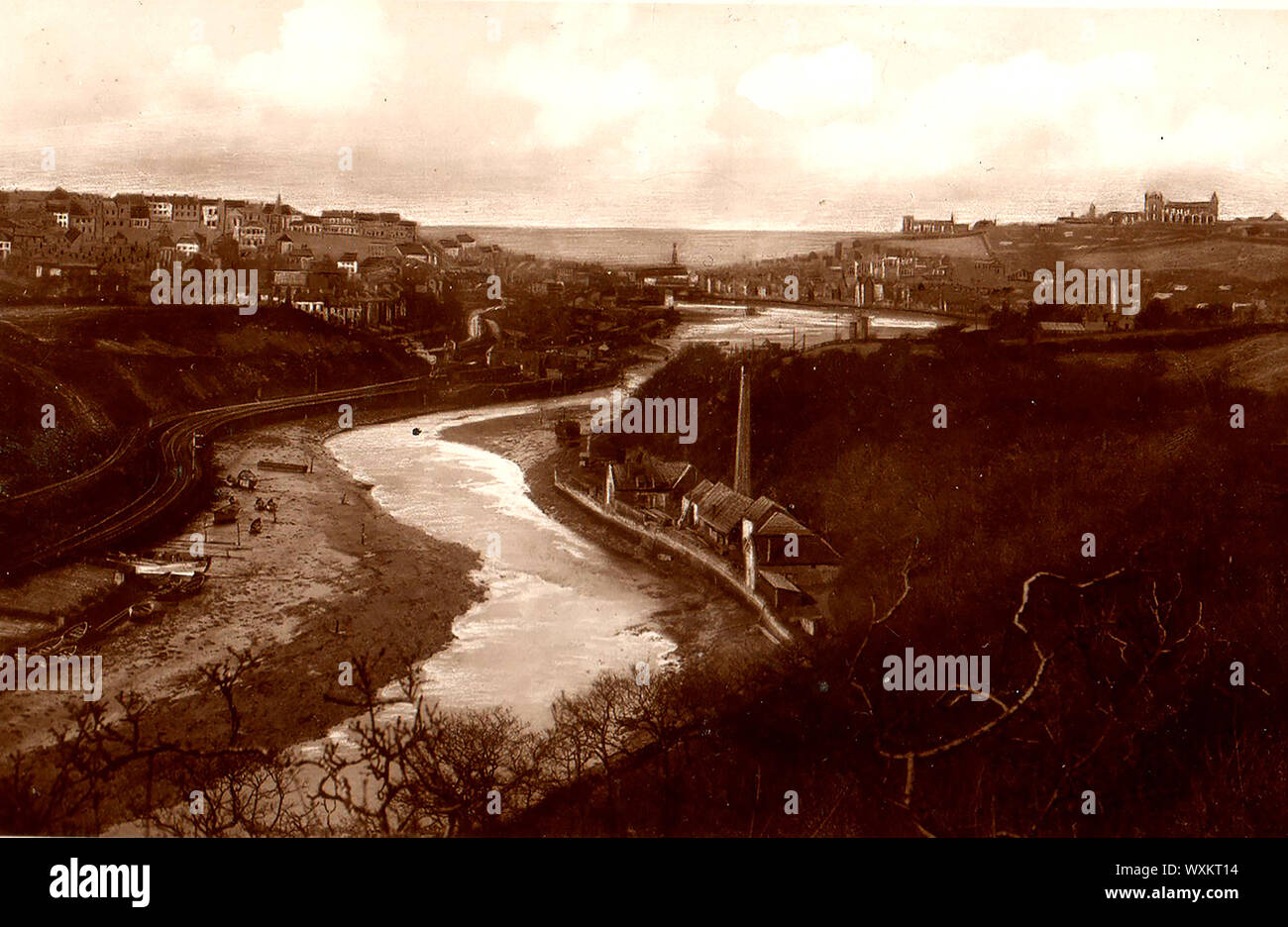 An early photo of Whitby, Yorkshire, England from Larpool showing the Prussian Blue Dye Works ((with tall chimney,right) - The process involved the oxidation of ferrous ferrocyanide salts  --- From a vintage postcard. Prussian Blue was also known as Berlin blue. Parisian or Paris blue and Turnbull's blue Stock Photo